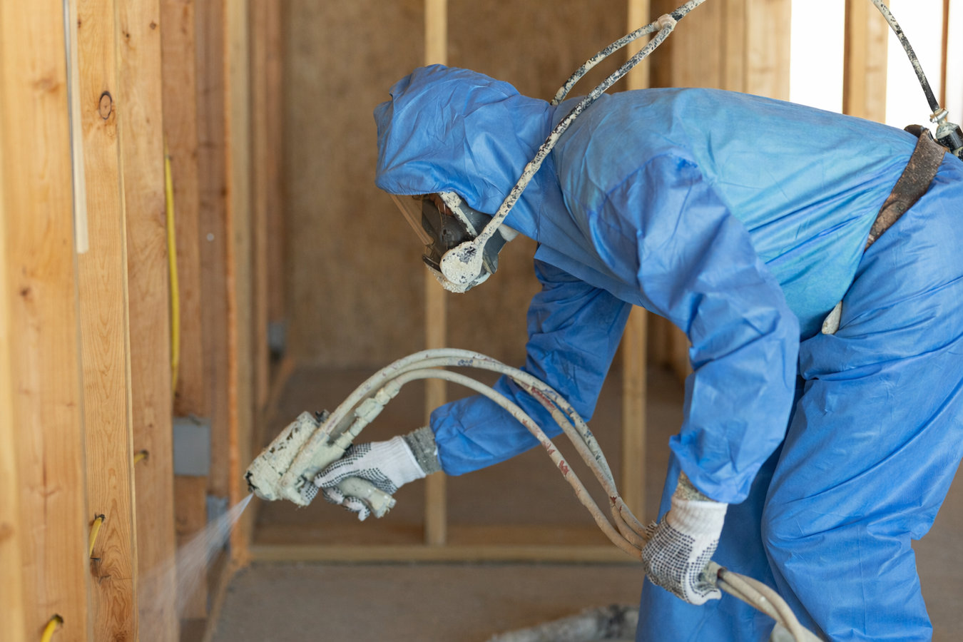 Insulation contractor at work in a Menifee, CA home
